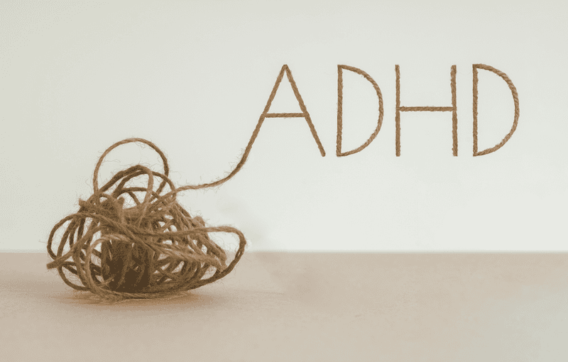 Knot of Knitting fabric spelling ADHD